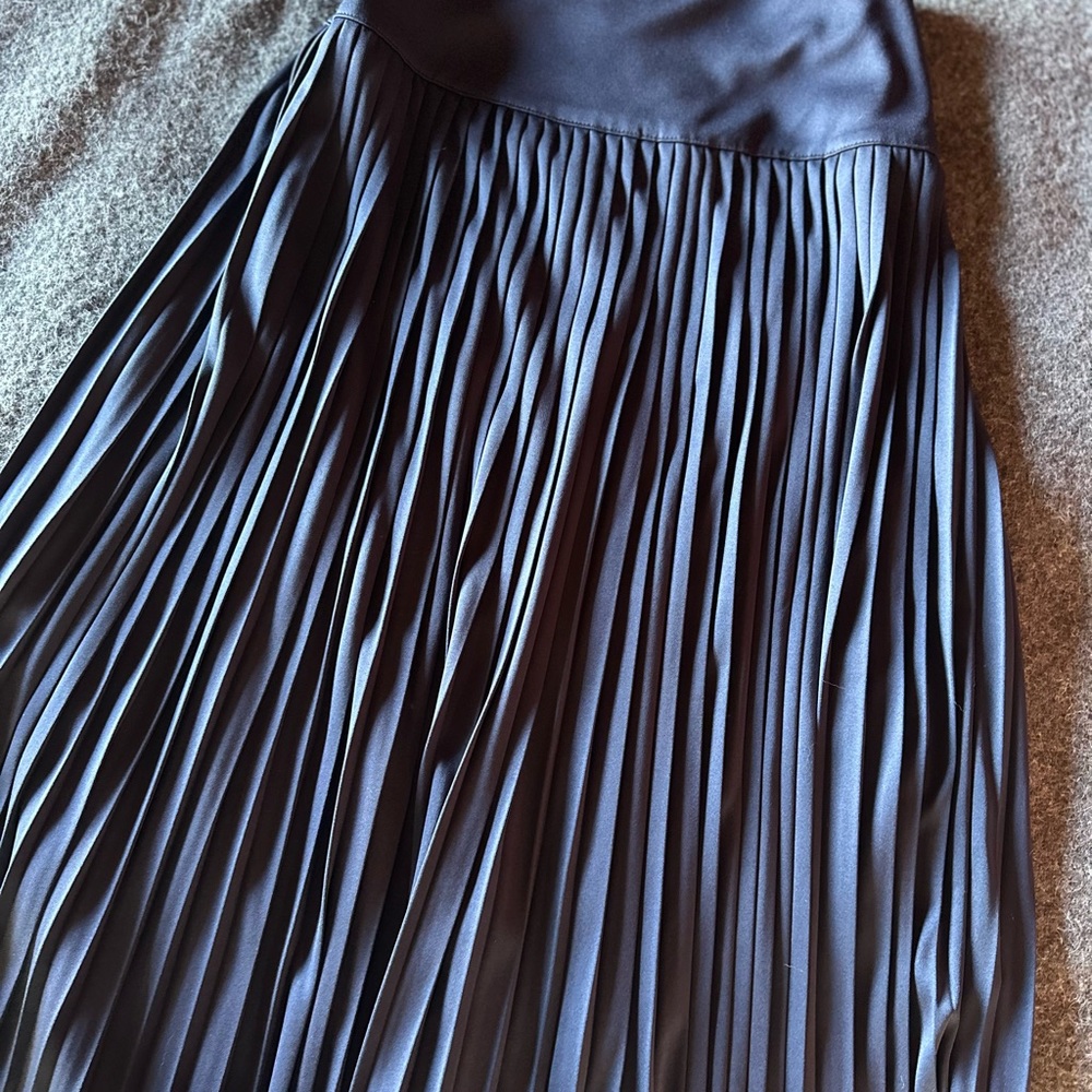 Satin blue pleated midi skirt.